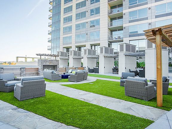 Courtyard with seating area and fireplace.