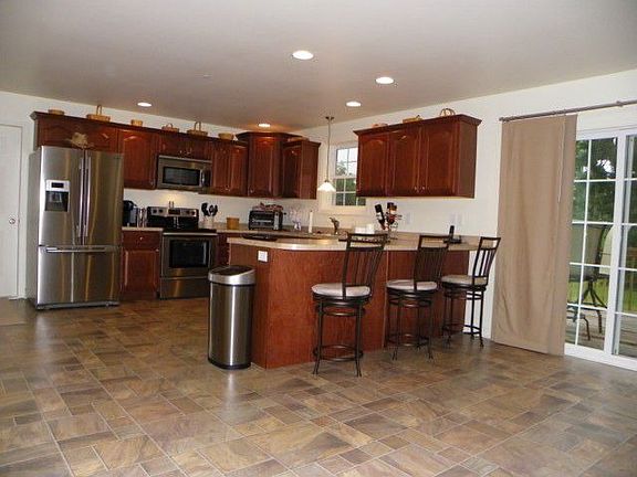 Built-in Breakfast Bar & Sliders Leading to Rear Deck