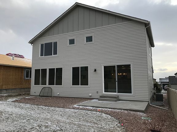 Exterior Rear Patio Photo representing home to be built and may demonstrate optional features