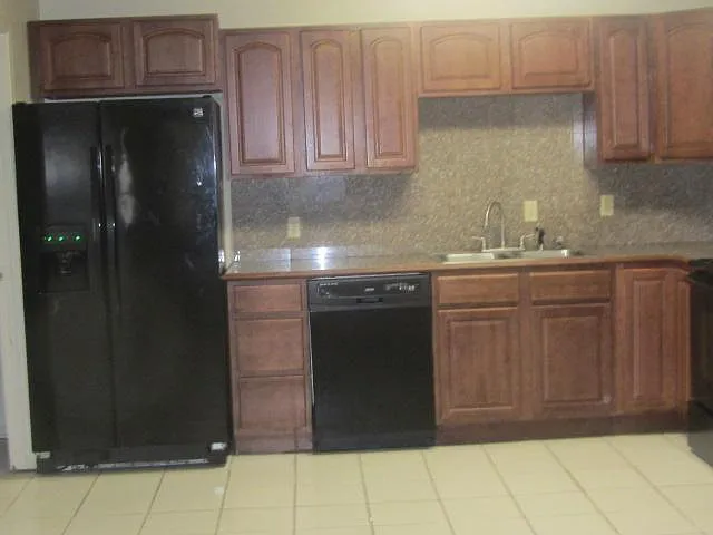 Large Kitchen/ Dining Room Side by side Refrigerator Freezer with Ice & water in the Door, Dishwasher, Built in Microwave Stove with self cleaning oven.