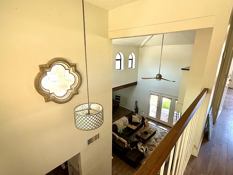 View of living room from upstairs landing