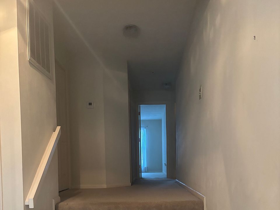 4 steps up to hallway leading towards bedrooms