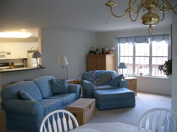Living room with the kitchen in the distance.
