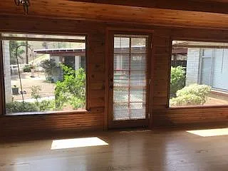 Family room has view of back yard and patio.