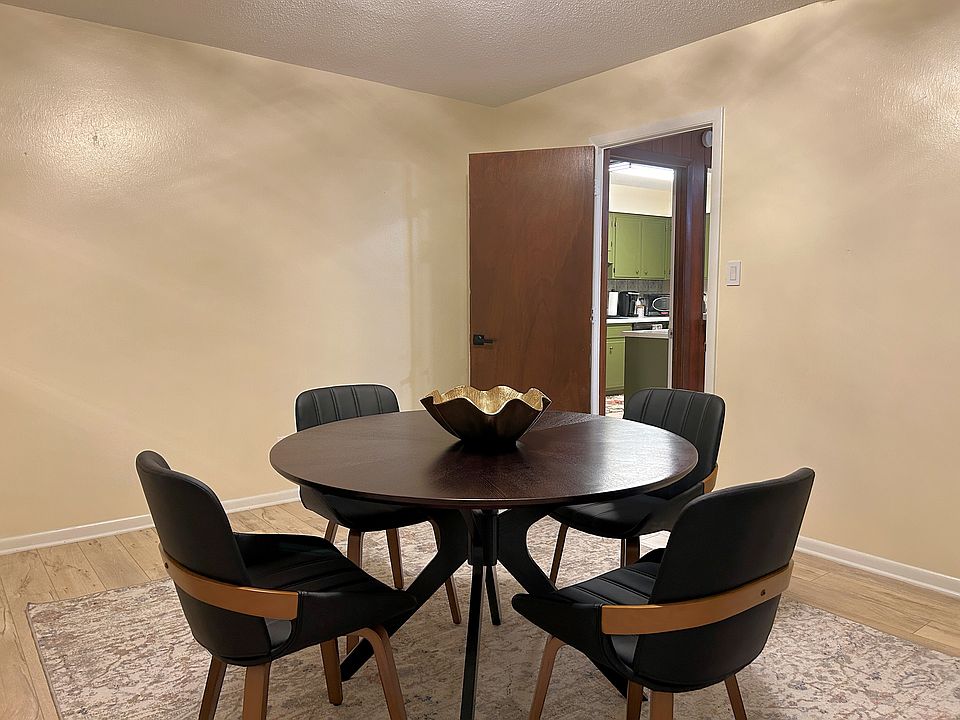 Large Dining room, can easily accommodate seating for eight plus hutch and buffet