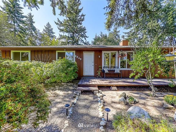 Mature landscaping in the front courtyard area.