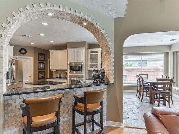Kitchen was fully remodeled in 2016 with granite counter tops, polished marble back splash and bar area and stainless steel appliances.