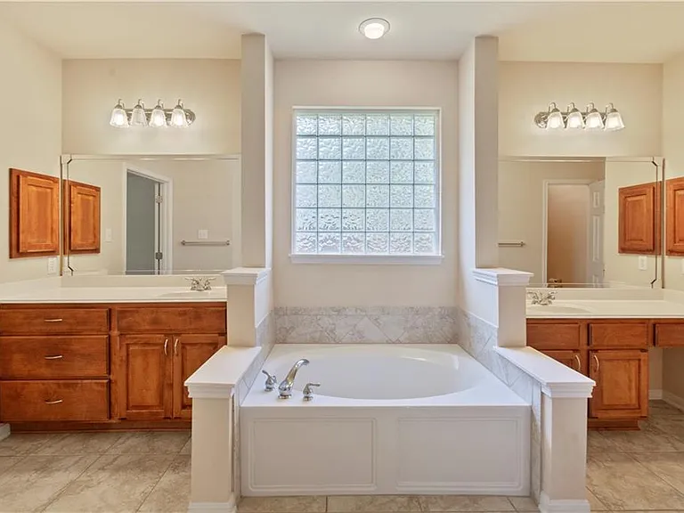 Master bathroom with double vanities, garden tub and a shower