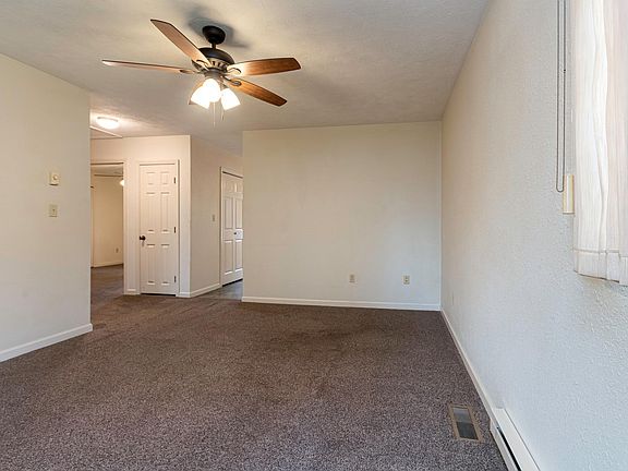 View from the front door entering the unit, Behind the partial wall is the kitchen.