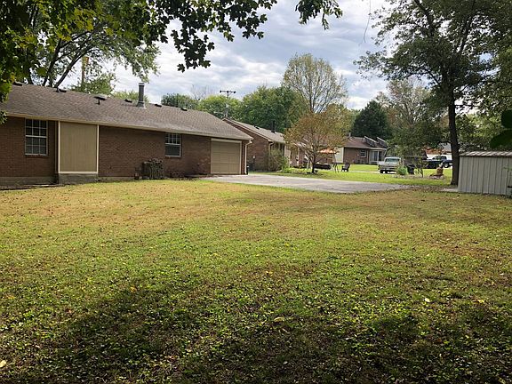 Large back yard with privacy. Large trees and bushes at the rear of the lot with no neighbors in sight behind the back yard.