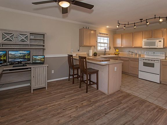 Open plan kitchen and casual dining or office space.