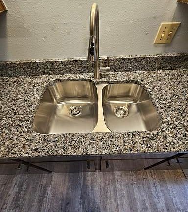 60/40 stainless sink and pull down faucet sprayer.