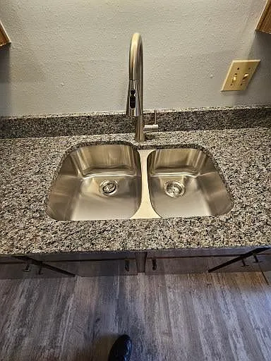 60/40 stainless sink and pull down faucet sprayer.