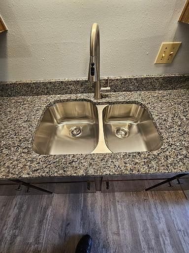 60/40 stainless sink and pull down faucet sprayer.