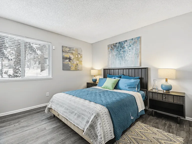 Large bedroom that includes a full size bathroom within the unit
