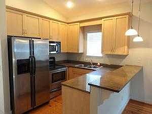 Kitchen w/granite counters & stainless steel appli