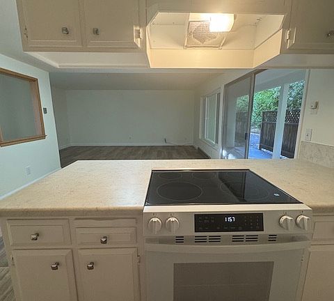 view from kitchen into dining and living area