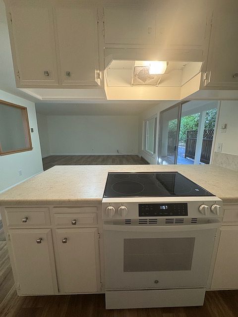 view from kitchen into dining and living area