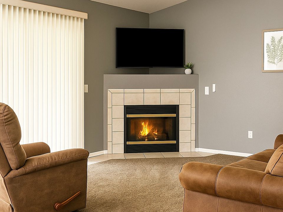 Living room with fireplace and outdoor patio access