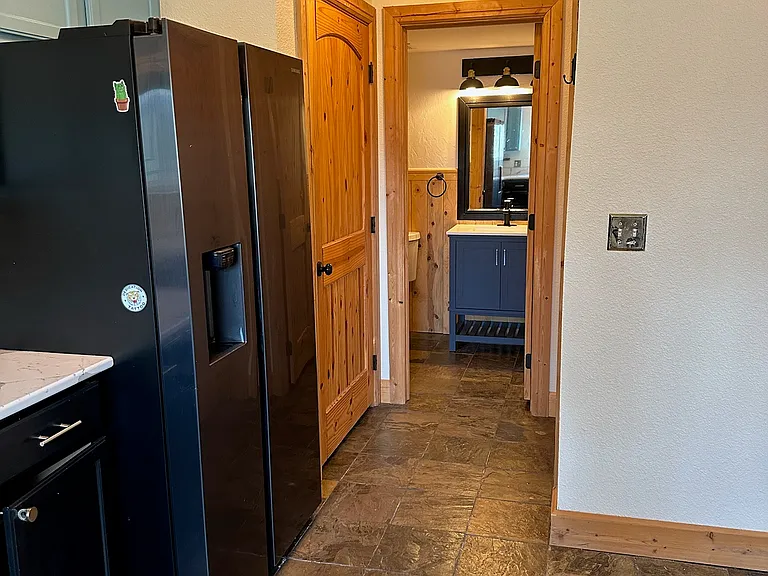 View from kitchen into half bathroom
