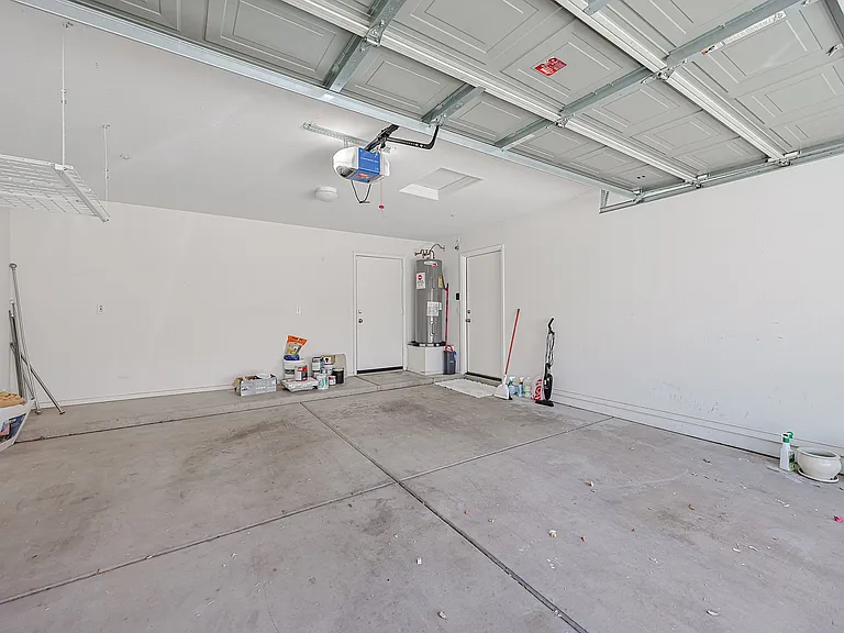 garage with walk out to backyard