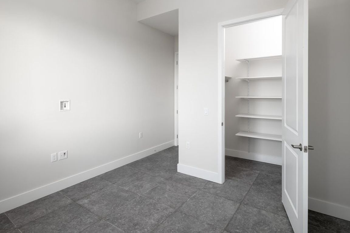 Signature Collection Three-bedroom apartment with custom closet shelving system