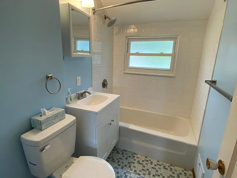 Bathroom is fully updated with all new fixtures, paint, and wall tile.