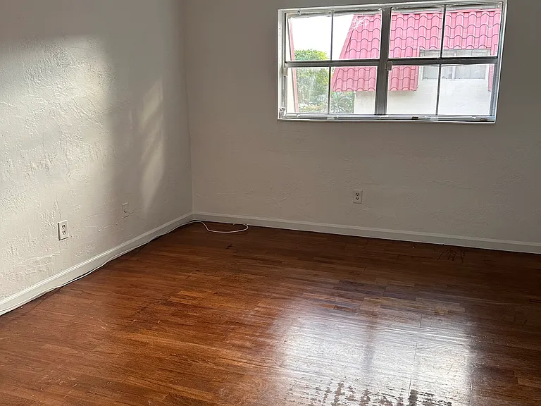 Master bedroom with wood floors