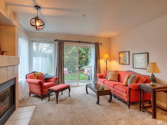 2 large windows and sliding glass door letting in plenty of natural light. 