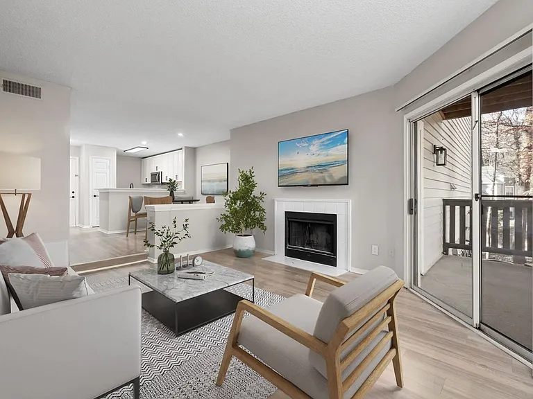 Sunken Living Room with Fireplace In Select Apartment Homes