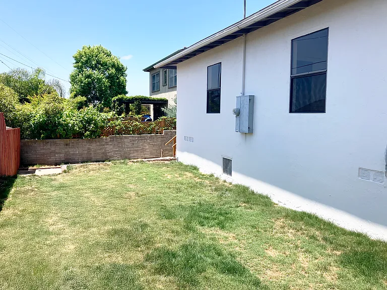 Backyard, facing rear patio (backyard elevation is a few feet higher than the patio)