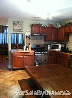 Cozy Kitchen
						:
						All stainless steel appliances. Brick back splash and new track lighting