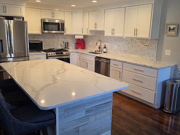 Remodeled (2024) Kitchen with 6 person island and built-in beverage fridge