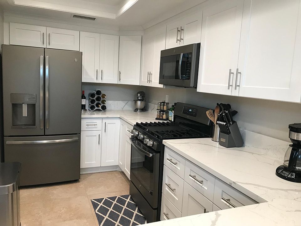 Newly remodeled kitchen with all new appliances. Quartz counters and soft closing cabinetry