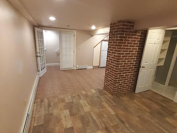 View of entry way and door into the bathroom.