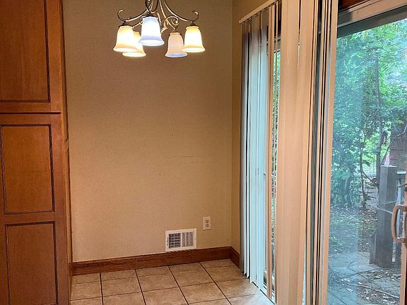 Dining area walks out to deck and fenced backyard