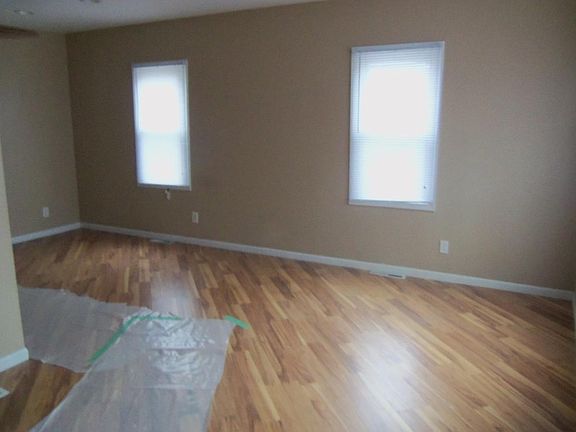 Connected living room dining room faux wood floors new blind