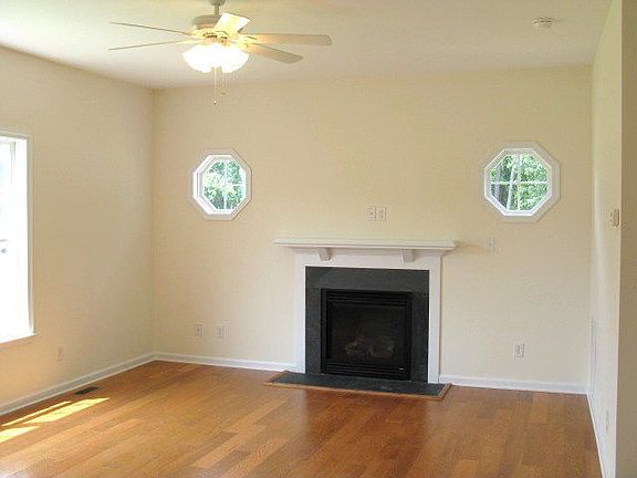 Bright, open family room  with fireplace.