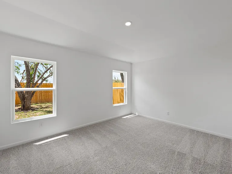 The master bedroom features its own walk-in closet.