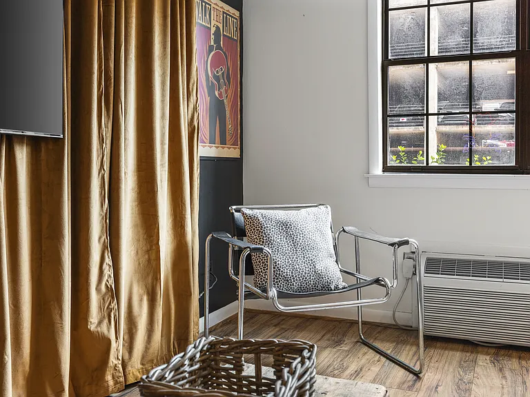 Cozy living room with a smart TV and a sleeper sofa. No stairs in this condo and located on the ground level, for easy access.