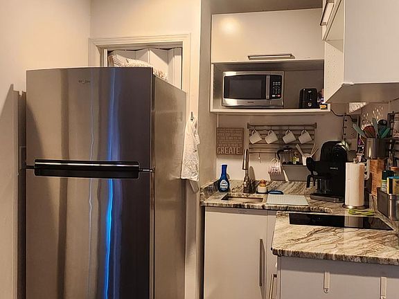 2 glass top range, microwave, refrigerator.