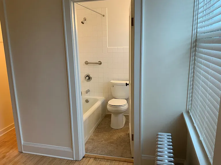 View # 2 into bathroom from Living Room.
