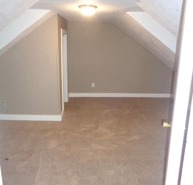Bedroom with vaulted ceiling