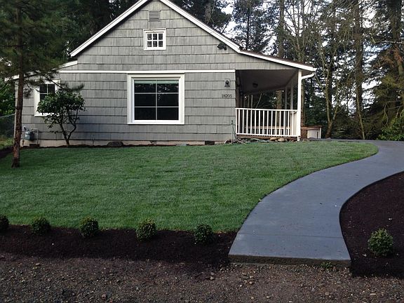 Long private driveway leading up to house.