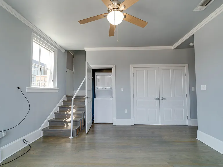 Steps lead to the roof-top deck. Washer and dryer included