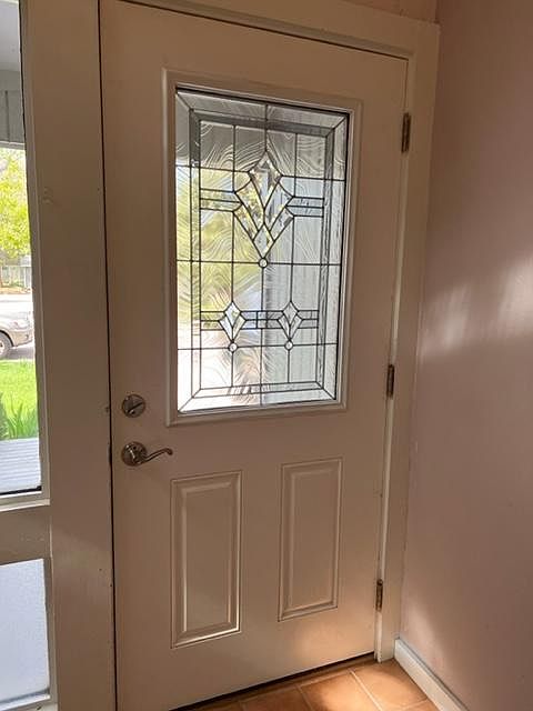 Front Door-Welcome to 907 Sailors Reef. From the entry, on the left you enter into...