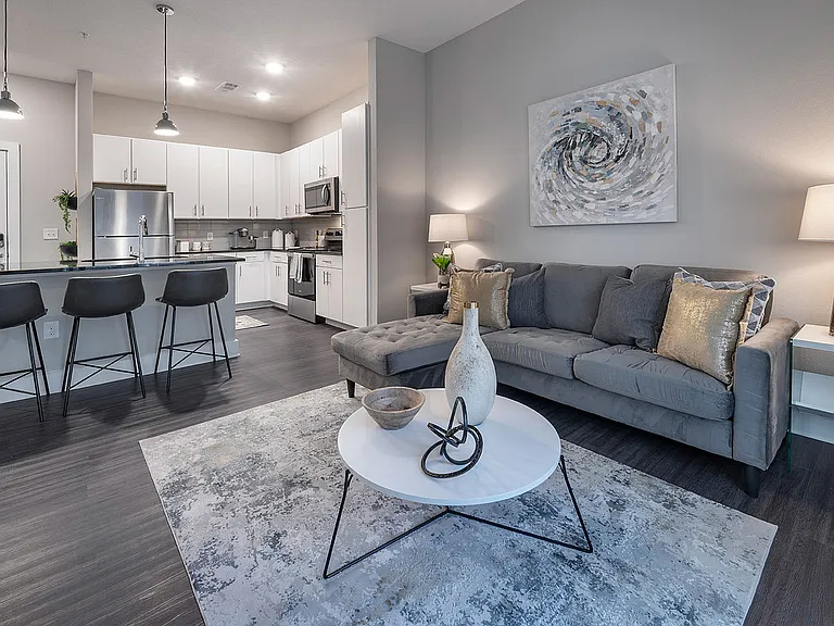 Embrace the sleek design of this chic urban apartment, where style meets comfort.