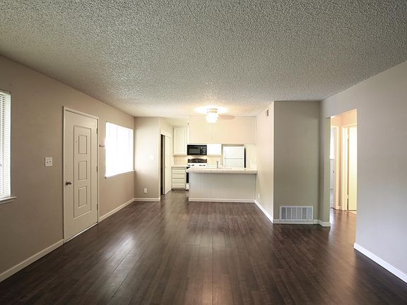 Looking from the living area. Kitchen, breakfast bar, large pantry on left, refrigerator included!