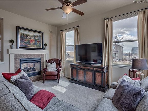 Warm and inviting family room with double sided fireplace!