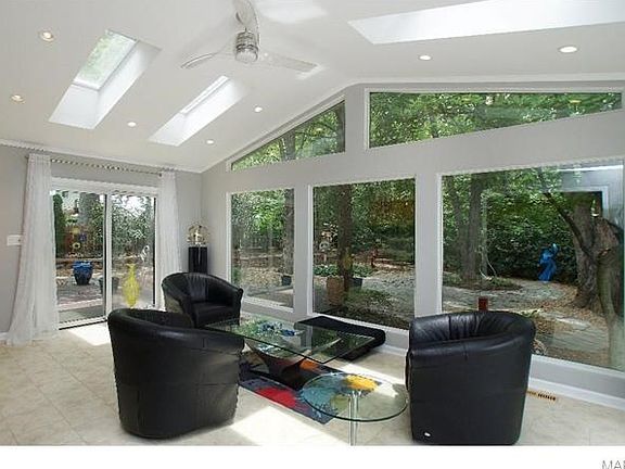 Vaulted Hearth room w Skylights, vault & yard view